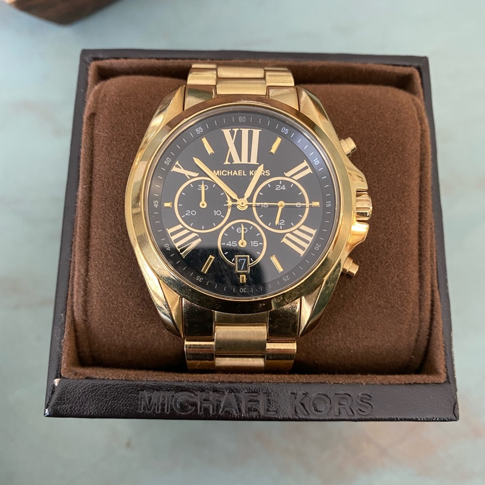 Gold, large face watch. Beautiful. Comes in box, with links. Needs battery